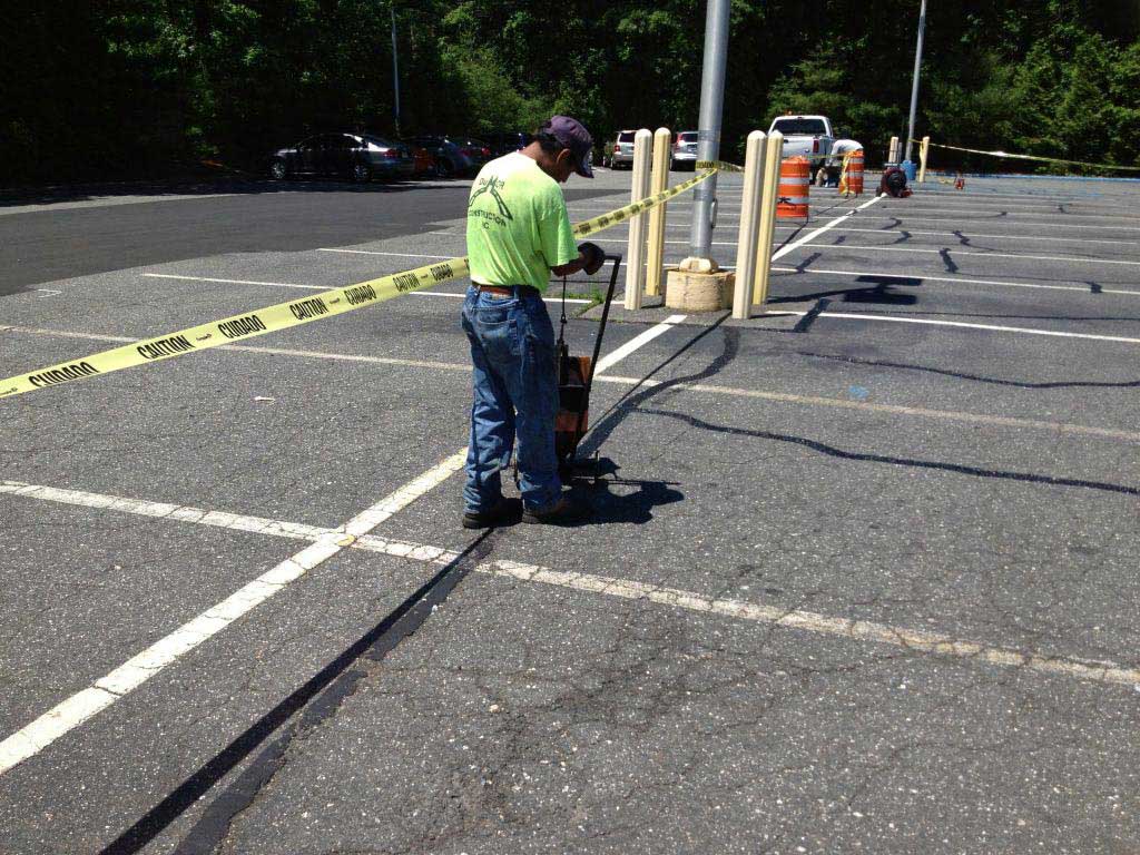 ASC Paving Filling Asphalt Cracks During Parking Lot Repair San Antonio